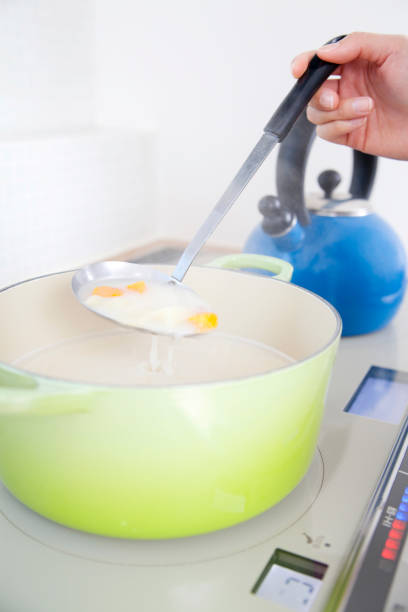 istock Women stir the stew's hand 674152620