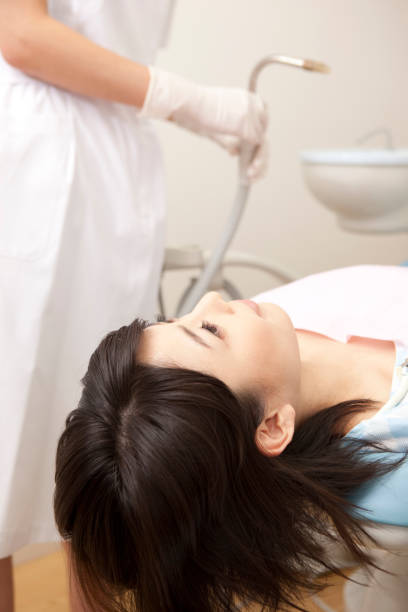 istock Female patients undergoing dental treatment 674152750