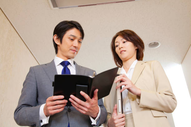 istock Businessmen chatting in the hallway and OL 674153082