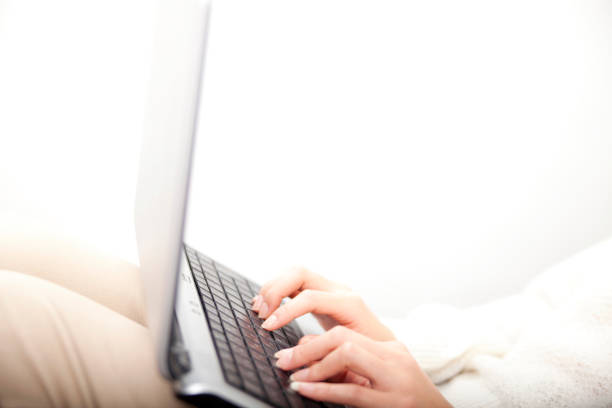 istock Woman using a laptop at hand 674153106