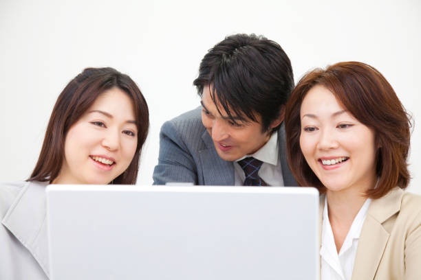istock Businessmen around the laptop and OL 2 674153578