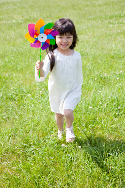 istock Have a windmill, smiling girl 674154376