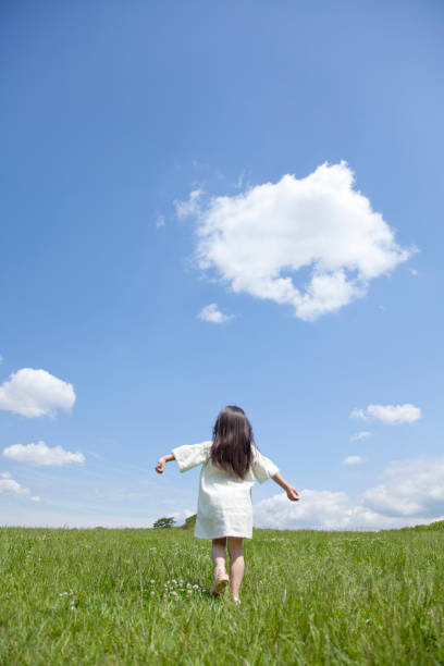 istock Walk through the Prairie girl from behind 674155934