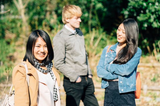 istock Three friends together in the park 674158998