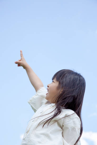 istock I pointed to the sky girls 674159136