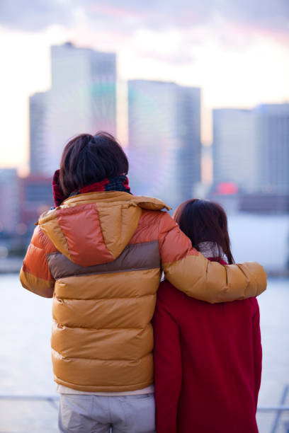 istock Shoulder to shoulder, watching the evening a couple of back 674159714