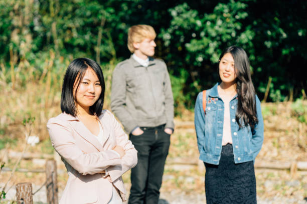 istock Three friends together in the park 674160654