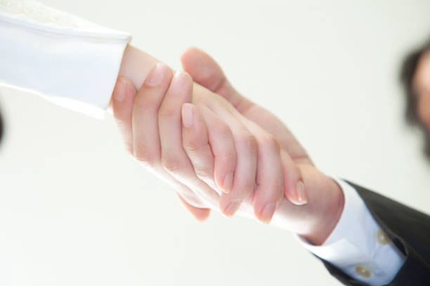 istock Businessmen shaking hands with OL 674160978