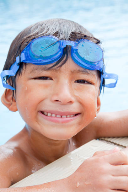istock Smile in the pool boy 674163460