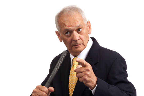 lecturing politician holding microphone, eyes  glaring, pointing finger, looking right - business person suspicion clothing well dressed imagens e fotografias de stock