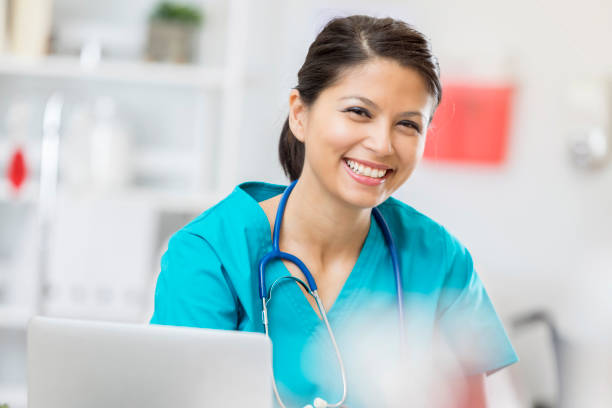 istock Smiling nurse in doctor's office 674163536