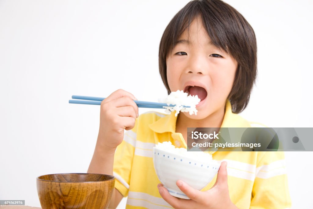 Children eat rice Adult Stock Photo