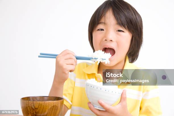 Children Eat Rice Stock Photo - Download Image Now - Adult, Asia, Boys