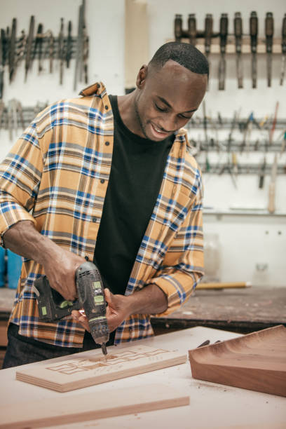 istock Male carpenter working with tools in his wood shop 674171194