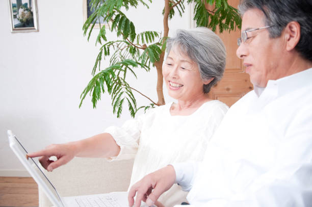 istock Look at laptop smiling senior couple 674171542