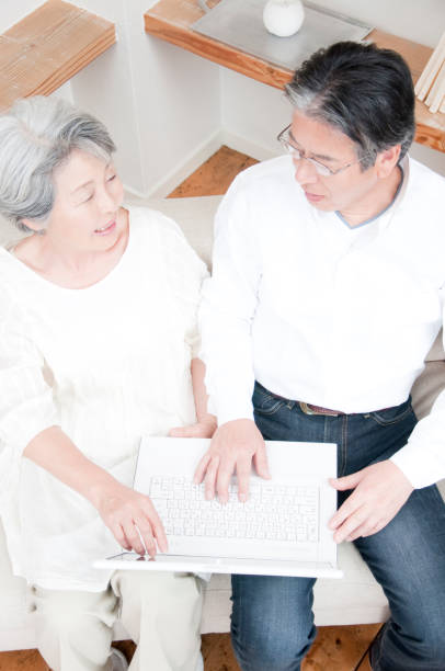 istock Look at laptop smiling senior couple 674171584