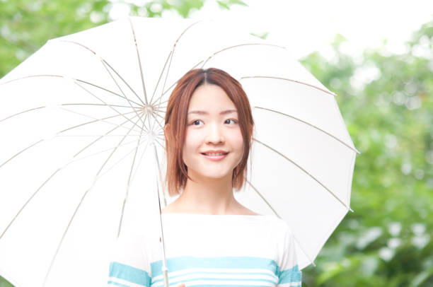 istock Female piercing walking umbrella 674177120