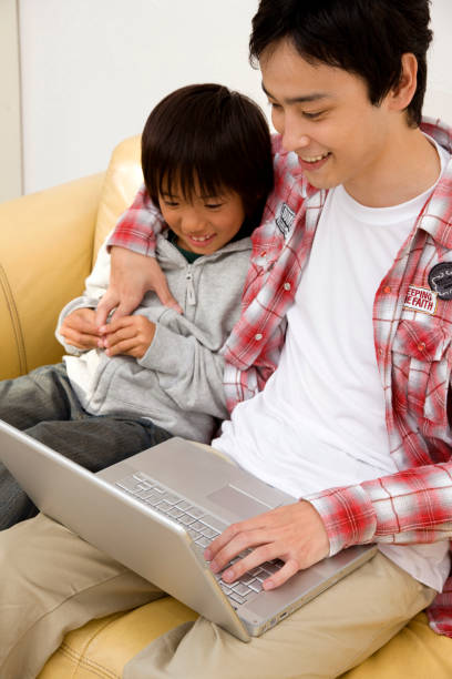 istock Parent-child play on laptop 674177236