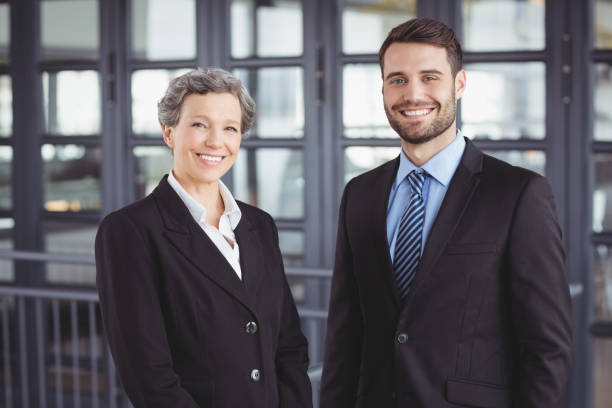 istock Happy business people standing in office 674178094