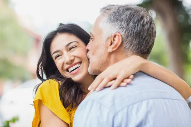 Photo of Close-up of man kissing woman