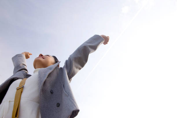 istock Women are relaxed, arms stretched toward the sky 674181402