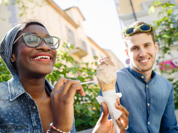 istock Young mixed race couple with ice cream 674188294