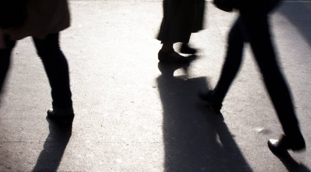istock Blurry legs on city sidewalk 674195700
