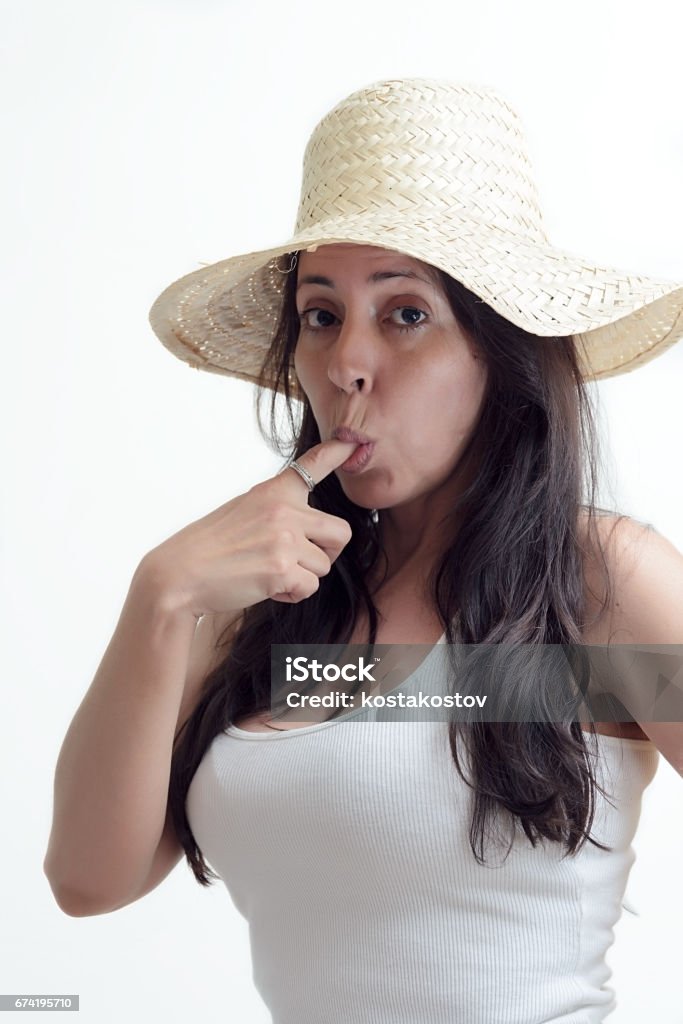 Confusion Brunette woman with finger in mouth Sergio Paulo Barbosa Stock Photo