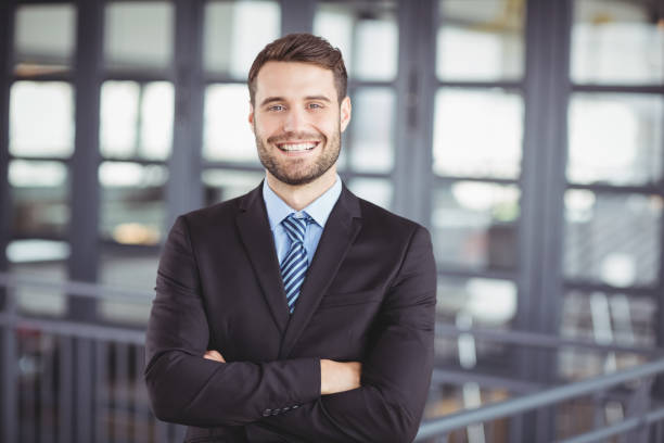 istock Happy businessman with arms crossed 674196318
