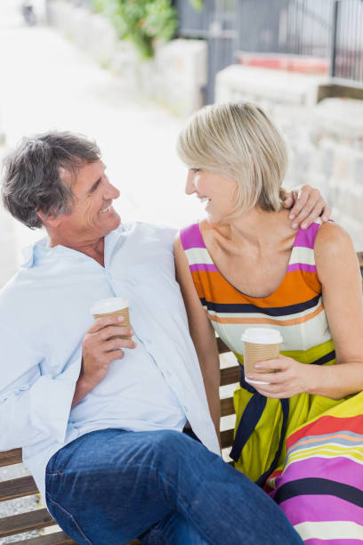 istock Cheerful couple with coffee cups 674200088