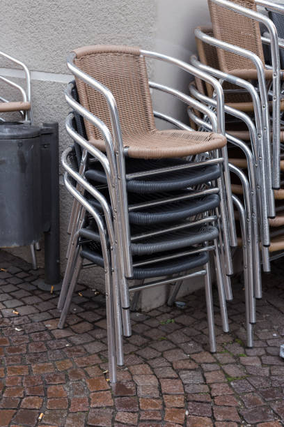 istock stackabel cafe chairs and table on a rainy day in south germany 674200972