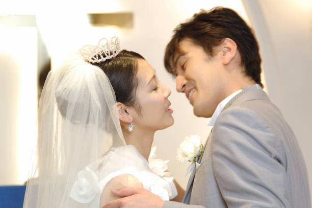 istock Bride and groom kissing 674201028