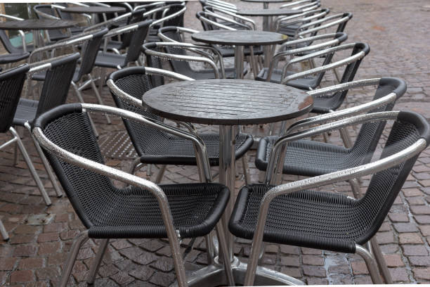 istock stackabel cafe chairs and table on a rainy day in south germany 674206642