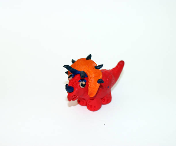 istock Plasticine  Dinosaur 3D sculpture on white background 674206646