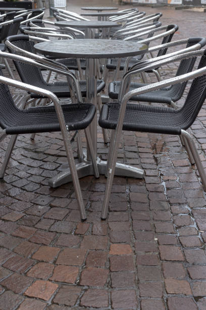 istock stackabel cafe chairs and table on a rainy day in south germany 674206802