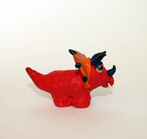 istock Plasticine  Dinosaur 3D sculpture on white background 674206934