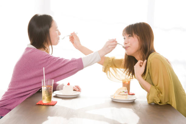 istock Two women meet to eat cake 674207134