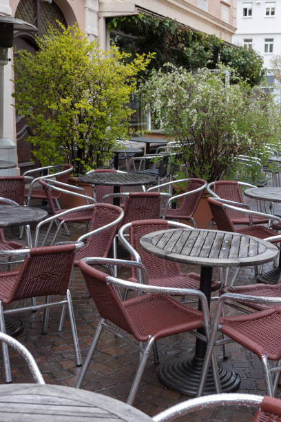 istock stackabel cafe chairs and table on a rainy day in south germany 674207250