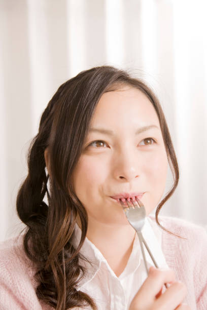 istock Woman eating cake 674213250