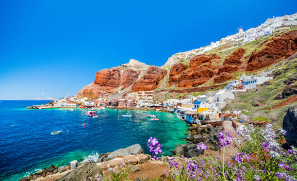 The old harbor of Ammoudi under the famous village of Ia at Santorini, Greece. The old harbor of Ammoudi under the famous village of Ia at Santorini, Greece. fira santorini stock pictures, royalty-free photos & images