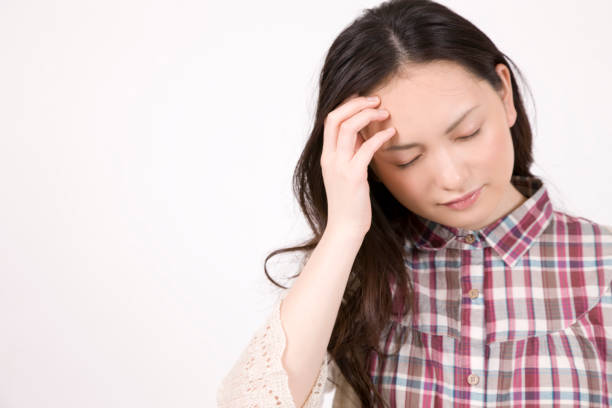 istock Woman holding head 674213822