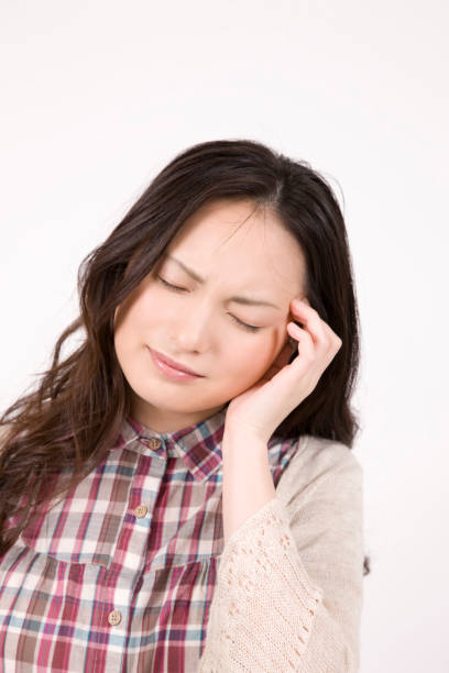 istock Woman holding head 674213834