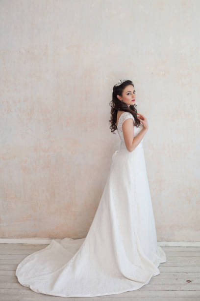 istock beautiful bride posing wedding hairstyle and dress 674214726