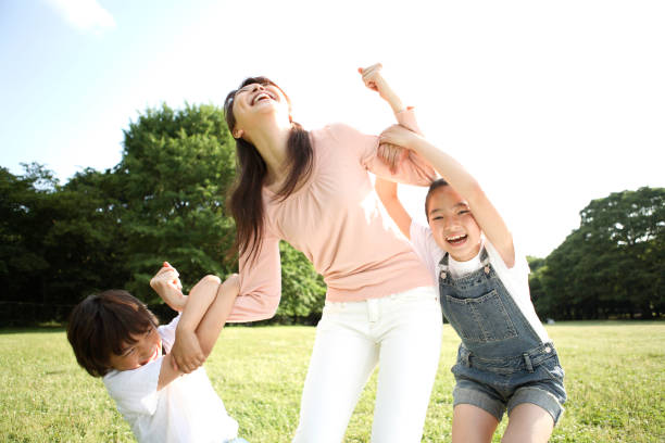 istock Parents and children playing in the Park 674214832