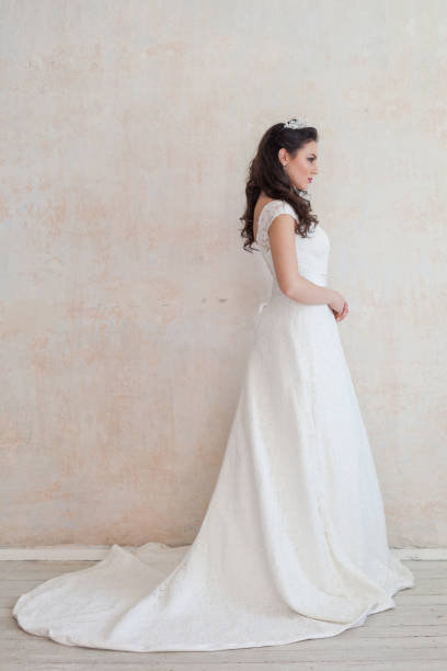 istock beautiful bride posing wedding hairstyle and dress 674214906