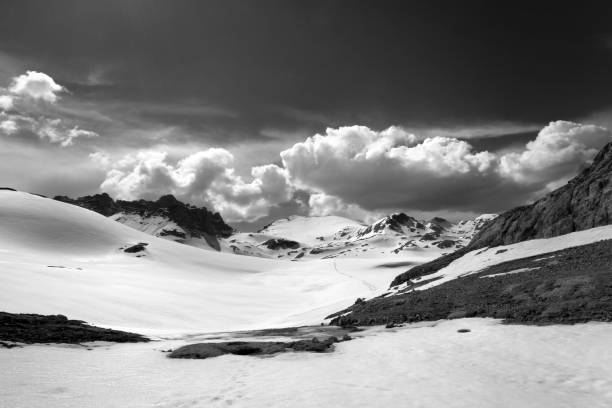 istock Black and white view on snow plateau with footpath 674215260