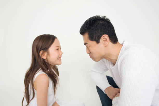 istock Father and daughter to a staring contest 674221226