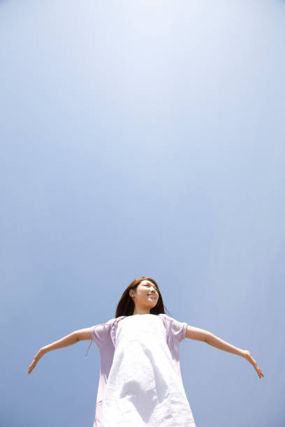 istock Women with open arms and feel the wind 674222068