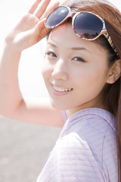 istock Women laughing and wearing sunglasses 674222426