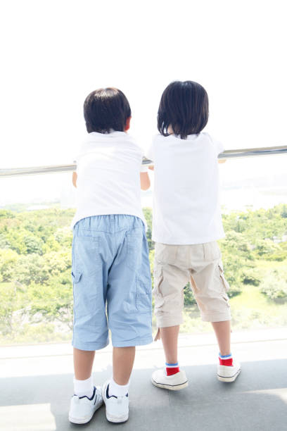 istock Children look out from the terrace 674222564